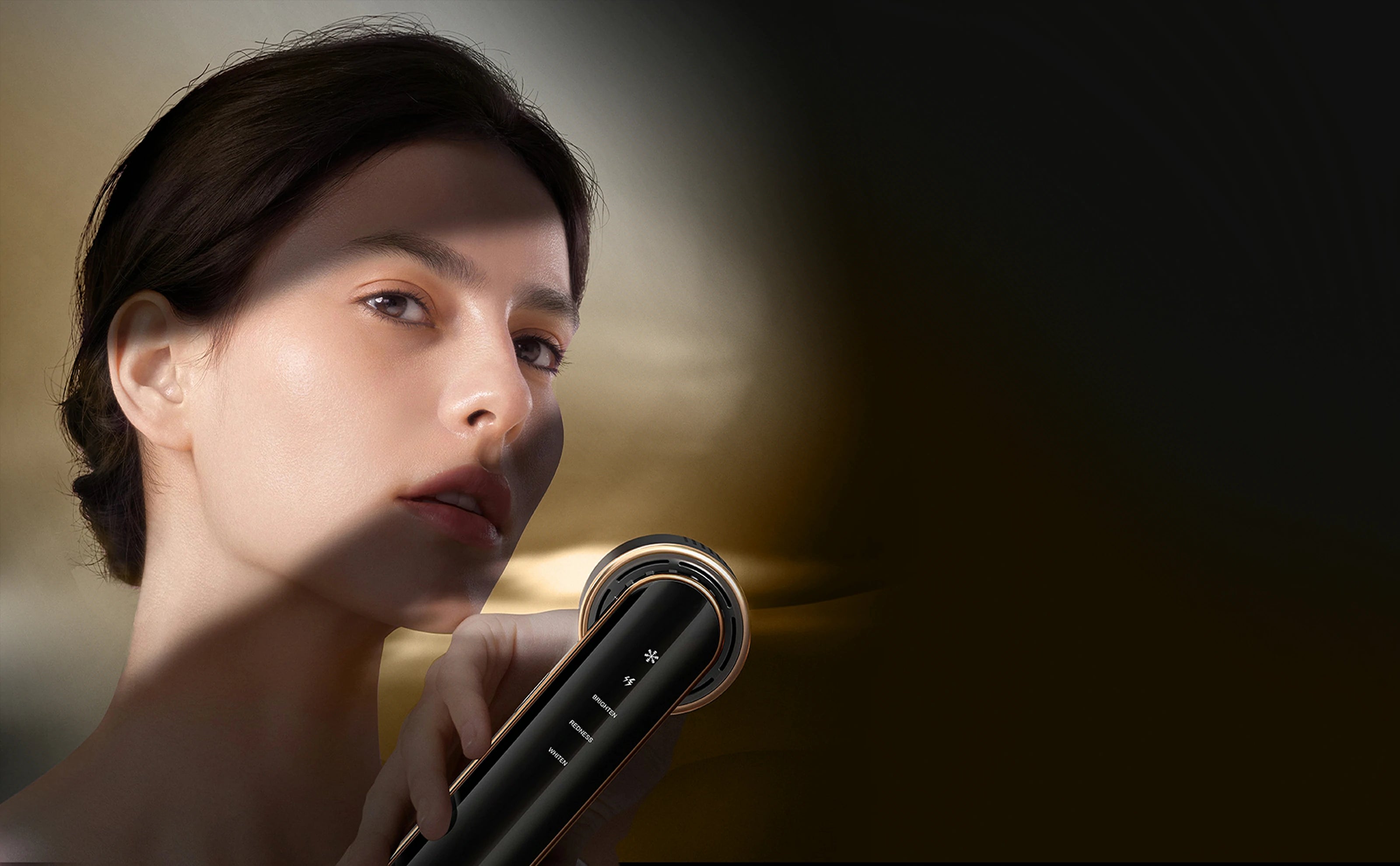 Woman experiencing advanced skincare treatment with the JOVS Blacken DPL Photofacial Device, showcasing a sleek design and efficacy.