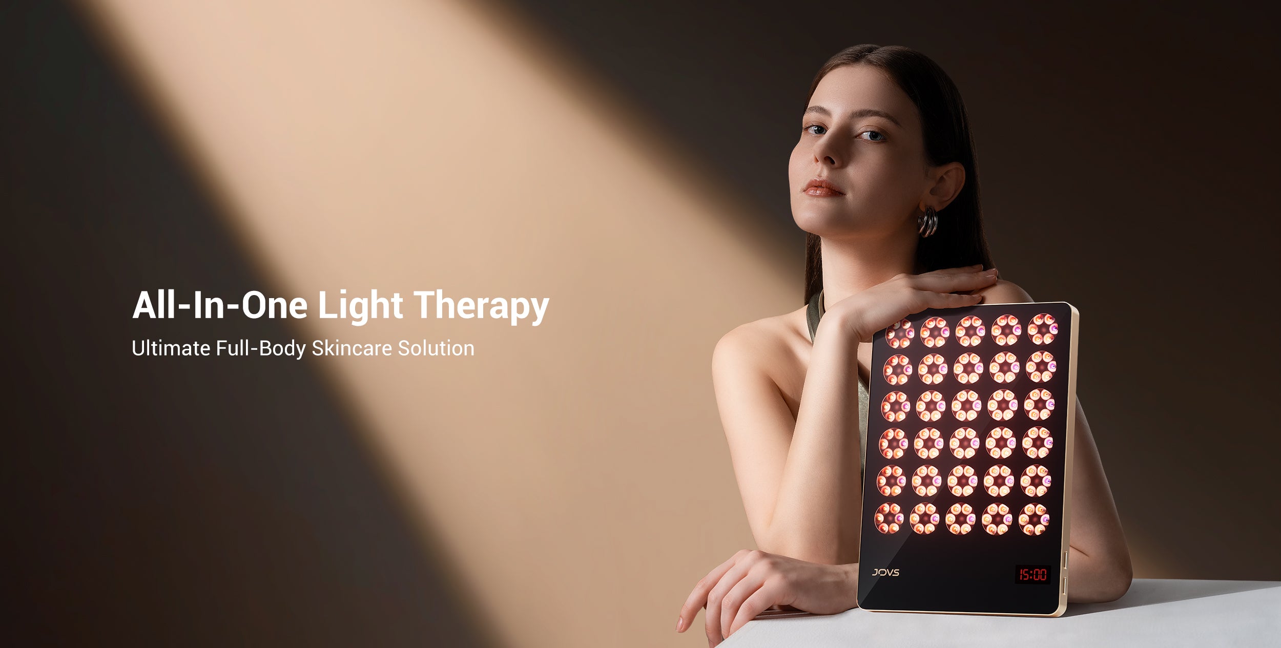 Elegant model presenting All-In-One JOVS Light Therapy Device for Full-Body Skincare.