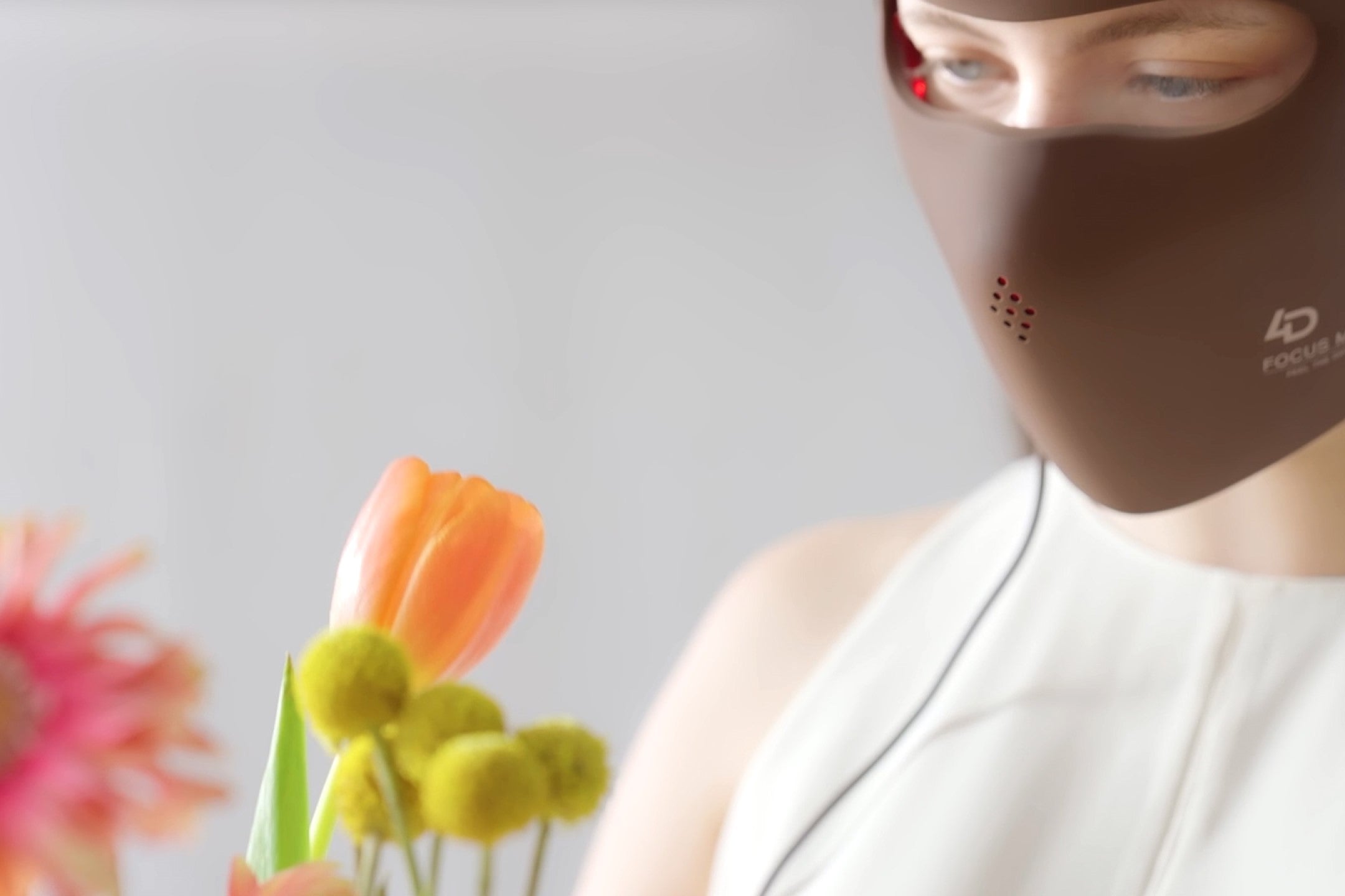 Close-up of a woman wearing a JOVS 4D Laser Light Therapy Mask, symbolizing advanced skincare technology.