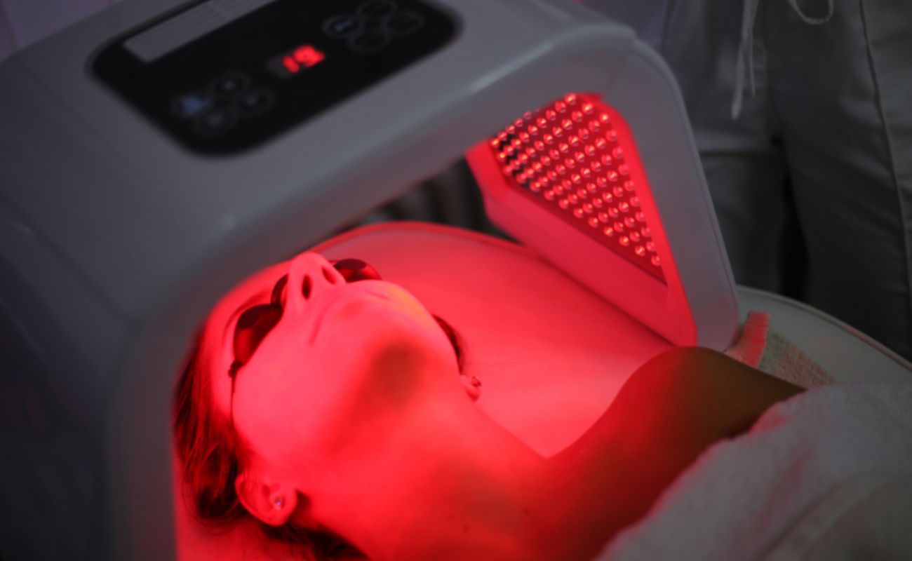Red light therapy for sleep improvement with a person using a red light mask at night