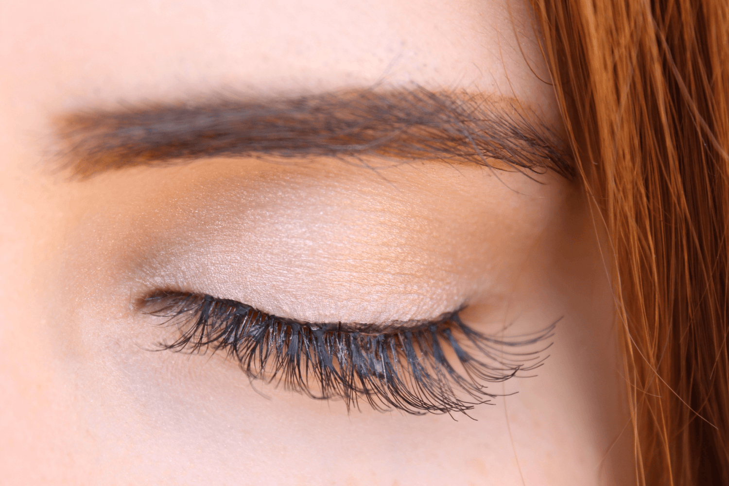 Close-up of a closed eye with mascara on eyelashes