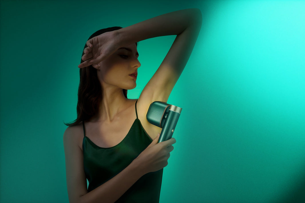 Elegant woman using JOVS Hair Removal Device for underarm hair removal