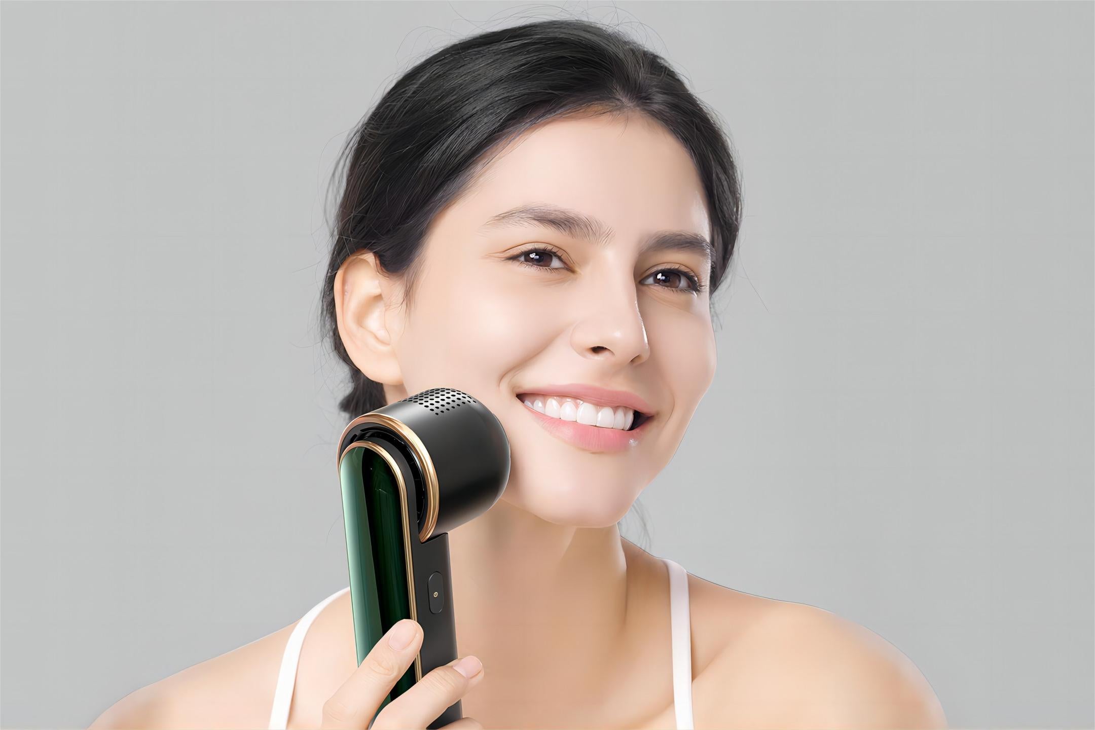 Smiling young woman incorporating JOVS Blacken PRO DPL Photorejuvenation Skincare Device into her anti aging skincare routine.