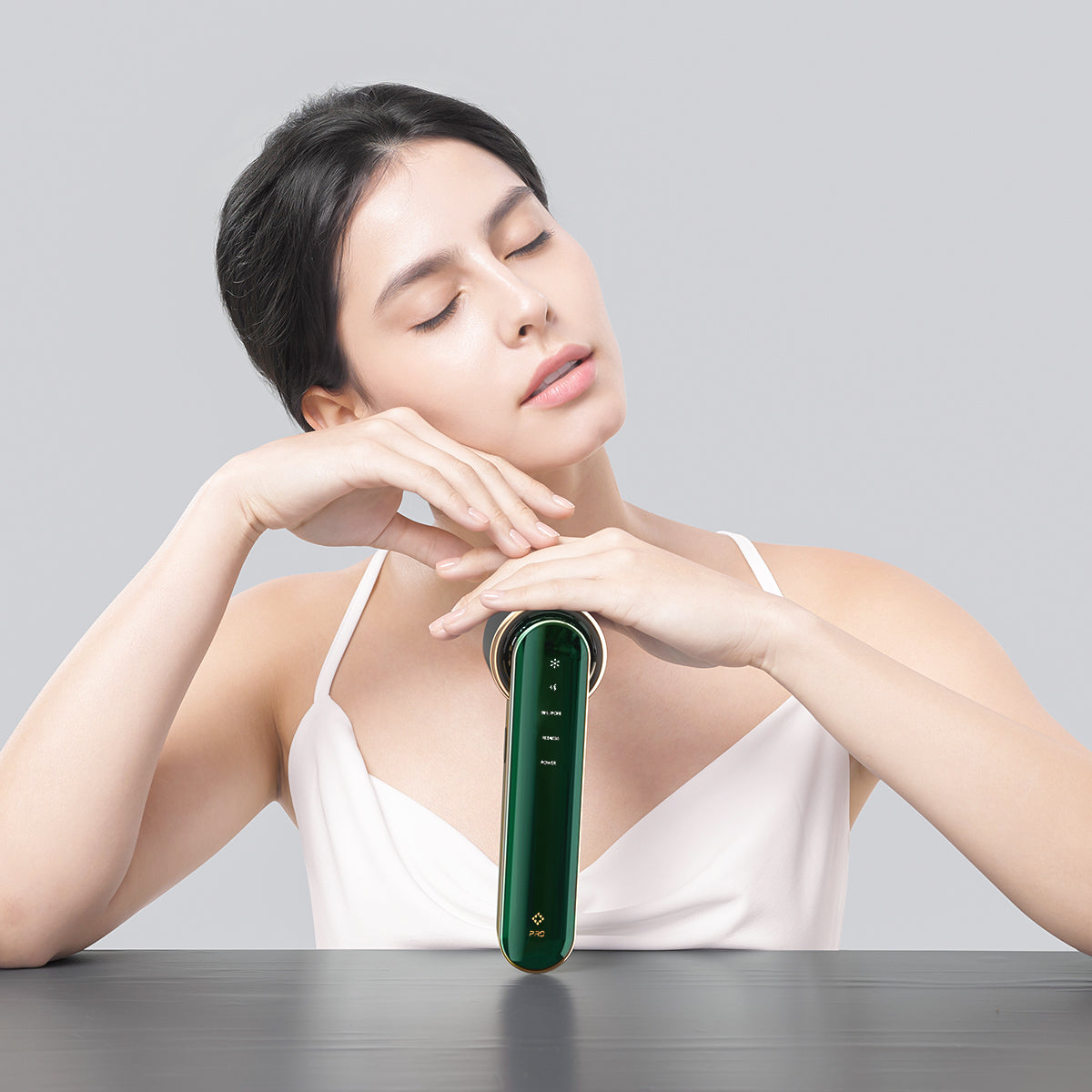 JOVS Blacken PRO DPL Photofacial Skincare Device showcased by a model, highlighting the sleek design.