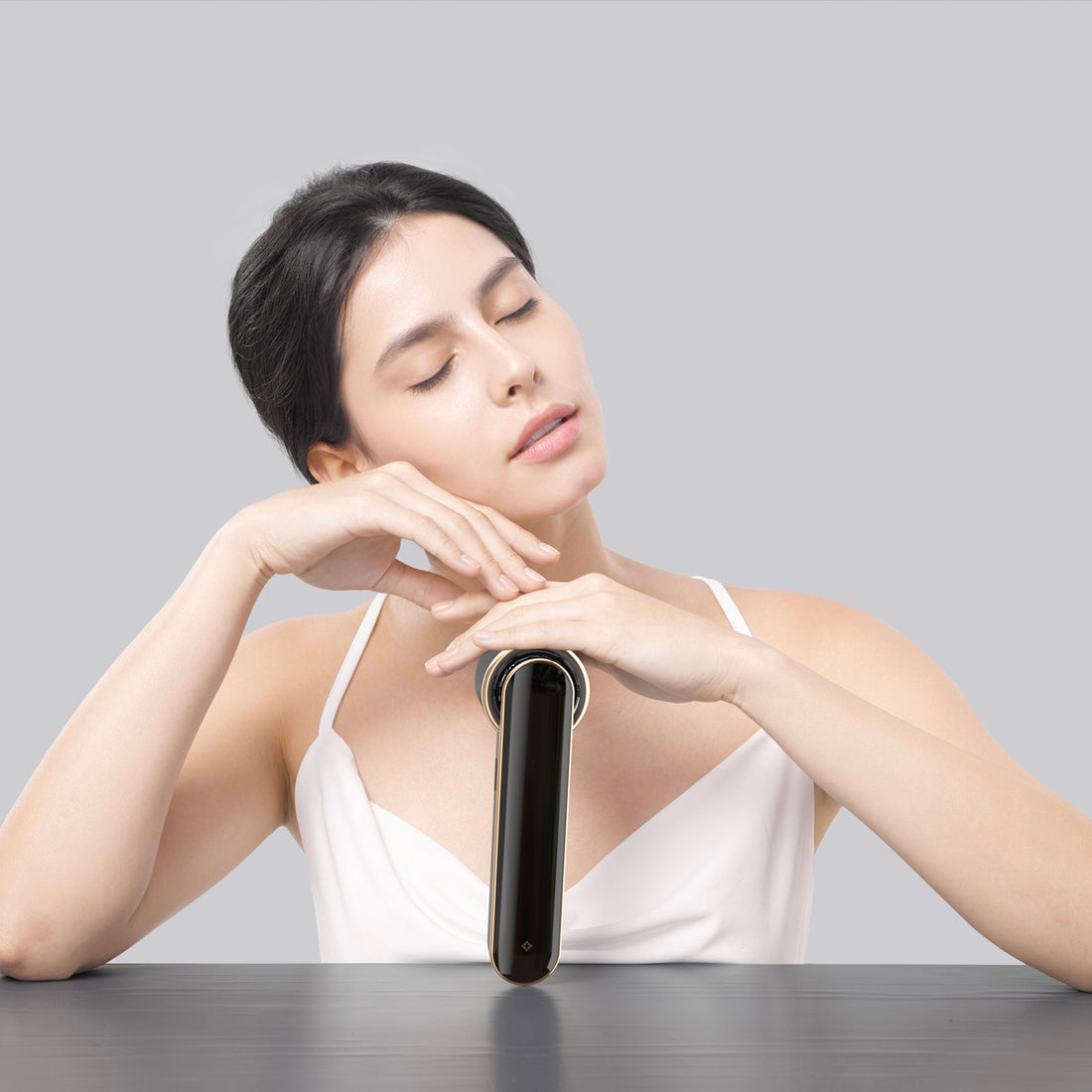 JOVS Blacken DPL Photofacial Skincare Device Woman showcases JOVS Blacken DPL Photofacial Device for enhanced skin care.